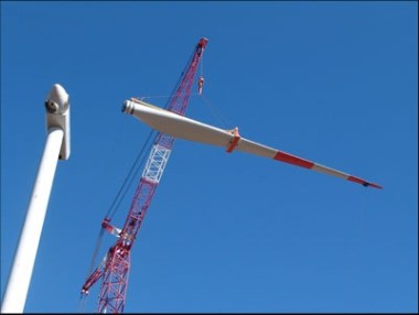 Wind turbine being assembled in Chile. Photo by Green Energy, from Wikimedia Commons. 