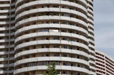 Solar panels face the sun from balconies of an apartment building in Mangyongdae District, Pyongyang, Aug. 27, 2014. REUTERS/Staff