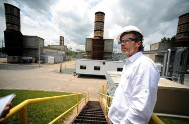 Kevin Thornton, a spokesman for Exelon, leads a tour of the power company's existing Summer Street plant in Medway earlier this summer. Daily News Staff Photo/Allan Jung