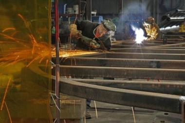 Welders for Specialty Diving Services in the Quonset Business Park working on the Deepwater Wind project. Photo by Sandor Bodo, The Providence Journal