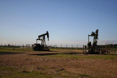 Nodding Donkeys Two of the oil pumps at the well head near Glentworth, Lincolnshire, UK. Photo by Richard Croft. CC BY-SA 2.0. Wikimedia Commons. 