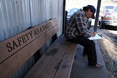 Coal miner in Colorado completing paperwork for the Enhanced Coal Workers' Health Surveillance Program (black lung screening). National Institute for Occupational Safety and Health photo. Public Domain. Wikimedia Commons. 