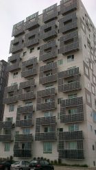 Solar PVs on the side of a building in Denmark. Photo by RhinoMind. CC BY-SA 3.0. Wikimedia Commons