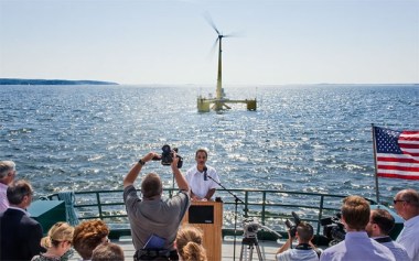 Habib Dagher, director of UMaine's Advanced Structures and Composites Center, in front of the VolturnUS prototype wind turbine deployed off the shores of Castine in 2014. Mainebiz file photo / James McCarthy