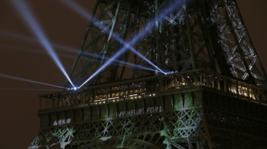 The Eiffel Tower was lit up on Sunday evening in support of the climate conference. Reuters 