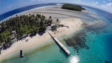 Climate change poses an existential threat to places like the Marshall Islands, which protrude only 6 feet (2 meters) above sea level in most places. (AP Photo/Rob Griffith) 