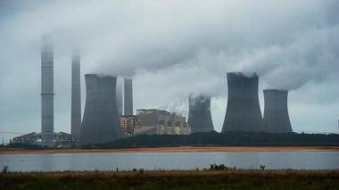 The coal-fired Plant Scherer is shown in operation early Sunday, June 1, 2014, in Juliette, Ga. AP