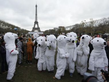 Activists in white bear costumes during the COP21 Conference. (Photo: Matt Dunham/AP)