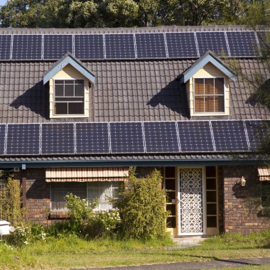 Rooftop solar panels via Shutterstock