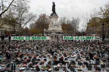 Hundreds of pairs of shoes are displayed at the place de la Republique, in Paris, as part of a rally. Laurent Cipriani/AP 