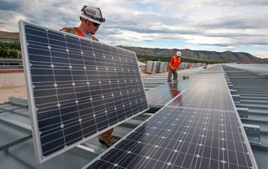 Contractors work on solar panels at the Department of Energy’s National Renewable Energy Laboratory (NREL) in Golden, Colorado.