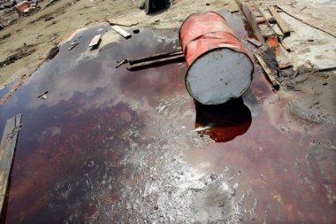  A barrel lies in a pool of oil at a damaged petroleum plant after an earthquake in Indonesia. Spencer Platt via Getty Images