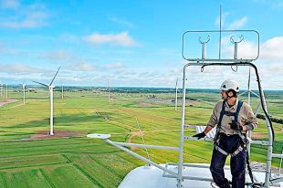 Wind energy, such as the wind farm on the marsh outside Amherst, has helped Nova Scotia Power surpass renewable energy targets. © File