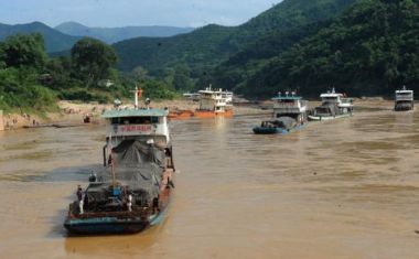 A boat makes its way down the Mekong River near the proposed Pak Beng Dam site, downstream of Chiang Khong district, Chiang Rai.