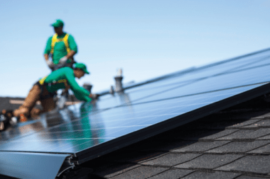 Workers for SolarCity install rooftop solar on a house. Credit: SolarCity