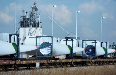Giant Vestas wind turbine blades are loaded on a train awaiting delivery at the plant on Tuesday. (Andy Cross, The Denver Post)