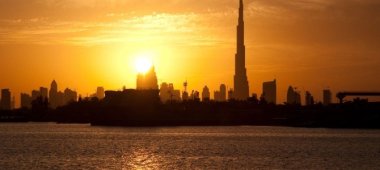 Sun setting over downtown Dubai. Taken from Festival City by the_dead_pixel via Flickr (CC BY SA, 2.0 License)