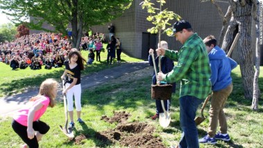 Chad Pregracke and his nonprofit surprised students by planting the group's millionth tree at their school.
