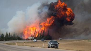 Wildfires burn in Alberta on May 7. Photo by Darryl Dyck / Bloomberg