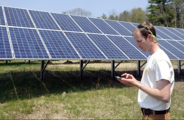Hans Albee, an engineer at the ReVision Energy, at the Sky Ranch Solar Farm in Kennebec County, Maine. Andy Molloy/Kennebec Journal