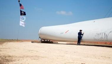 Signing a wind turbine blade at the Kingman Wind Energy Center.