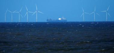 A ship sails past the 90-MW Barrow offshore wind farm. Reuters / David Moir