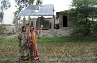 Residents of Sardar Para in Satjeliya Island and the village's solar panels. WWF photo.