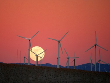 Moonrise at a wind farm. Image Credit: Flickr via "Caveman Chuck" Coker