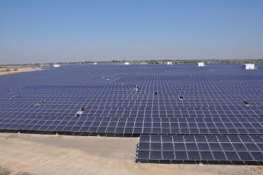 An 11.5-MW solar array in India. Photo by Citizenmj. CC BY-SA 3.0. Wikimedia Commons.
