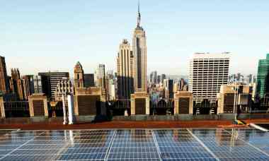 Solar panels on a Rockefeller Center rooftop in midtown Manhattan in New York. (Photograph: Mark Lennihan / AP)