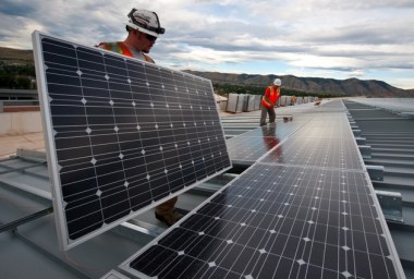 Installing solar panels (Wikimedia Commons)