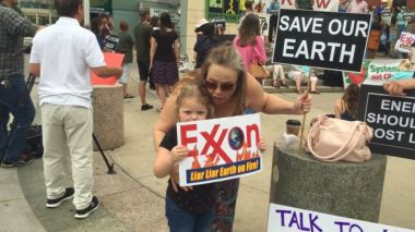 Protestors young and old making their feelings heard at the Exxon Mobil annual general meeting in Texas